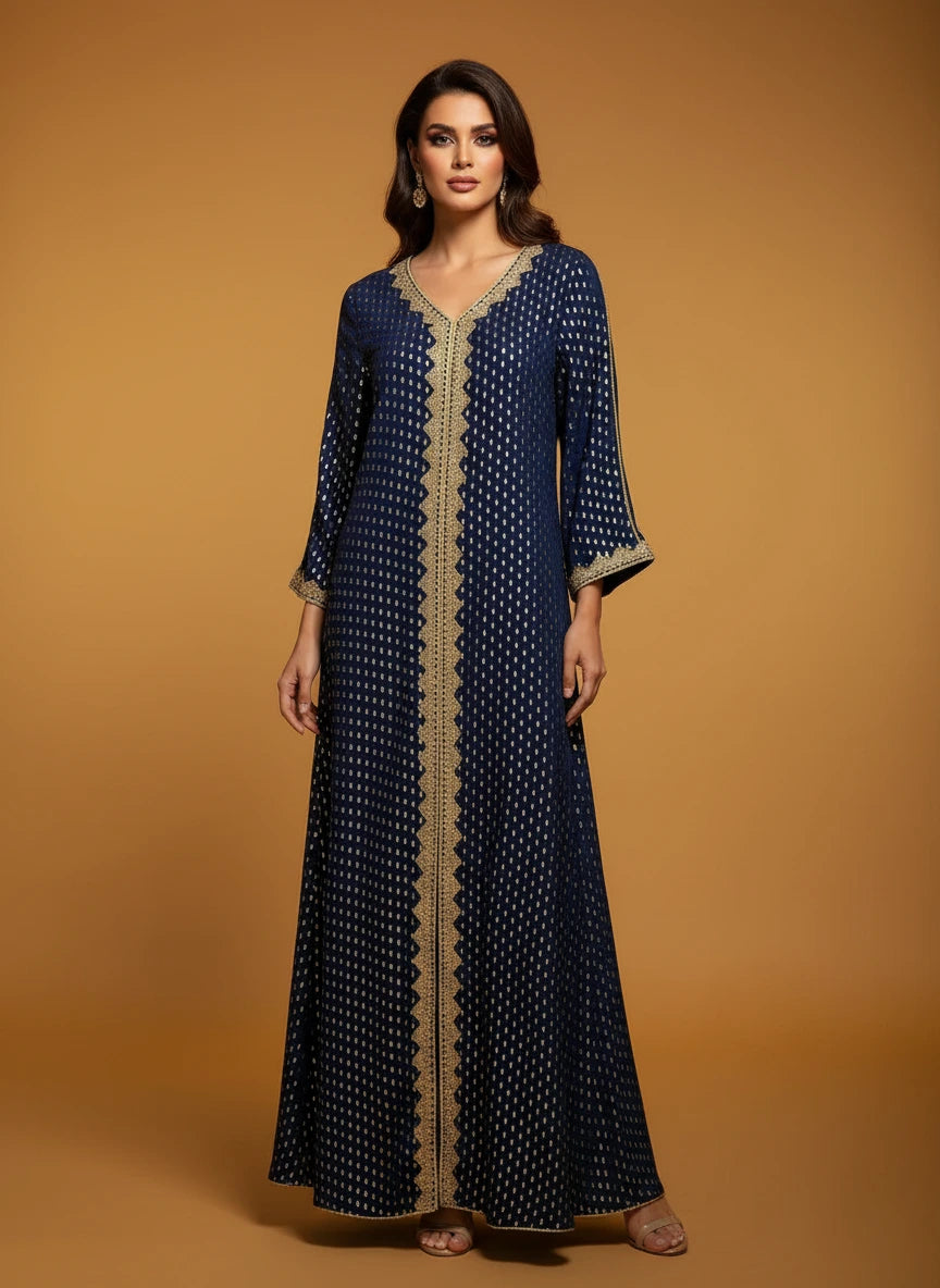 Blue patterned dress on a mannequin against a white paneled wall.
