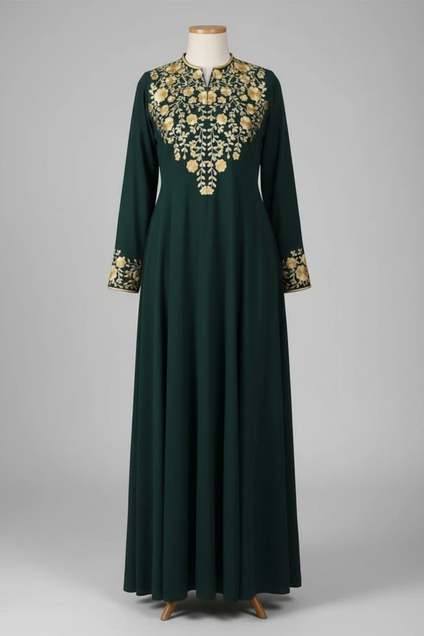 Green dress with gold embroidery on a mannequin against a gray background