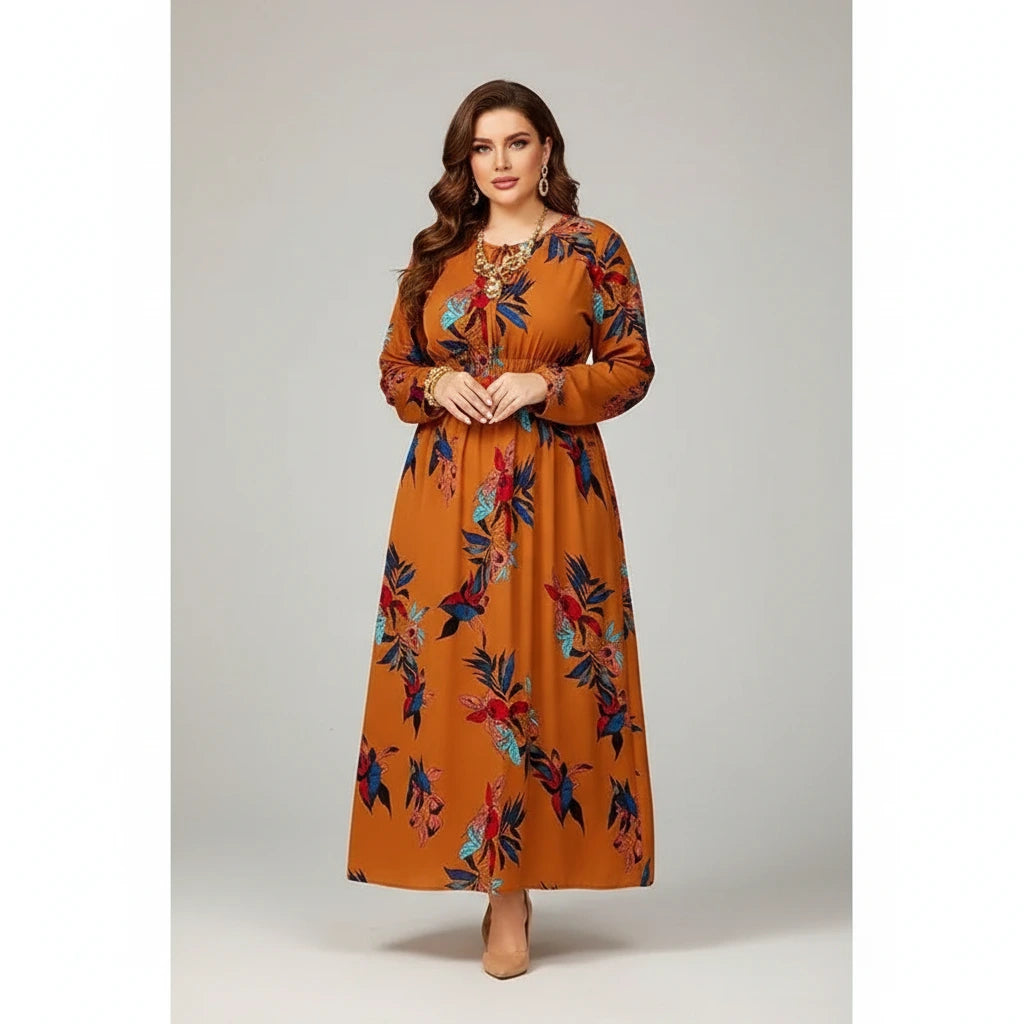 Woman wearing a long, patterned dress against a plain background