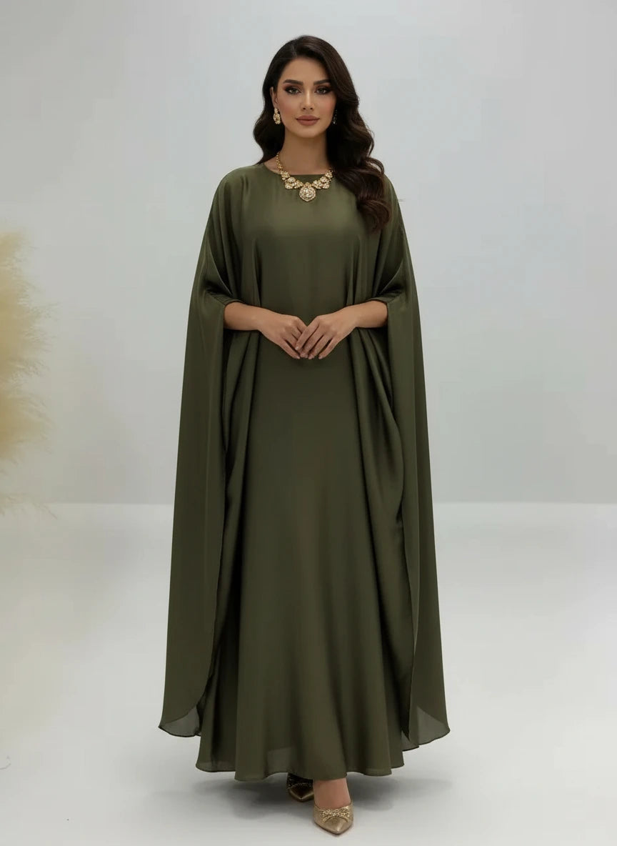 Olive green dress on a mannequin against a white background