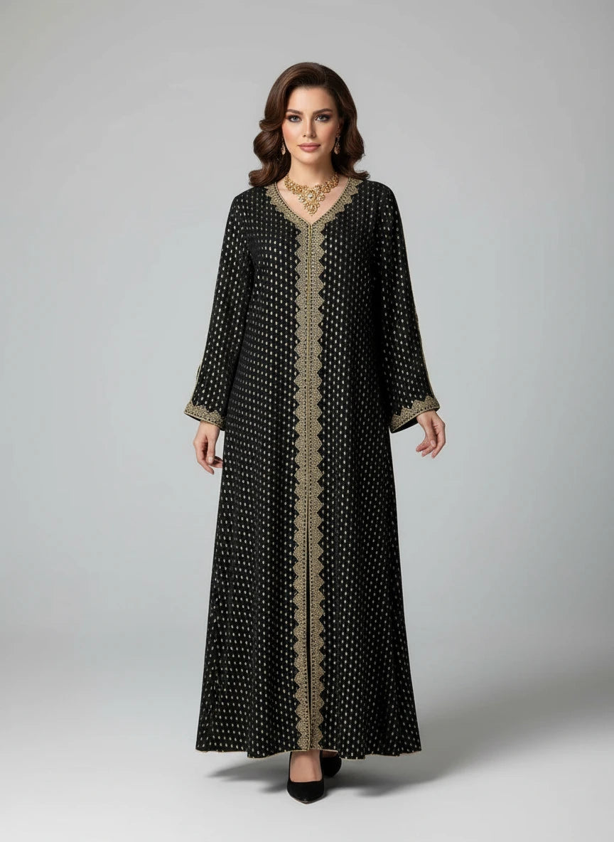 Black patterned dress on a mannequin against a white paneled wall.