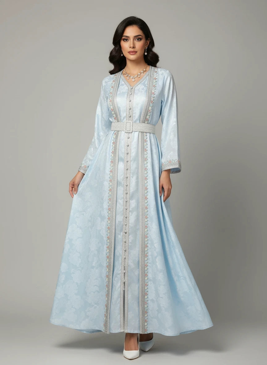 Light blue dress with intricate detailing on a mannequin against a neutral background