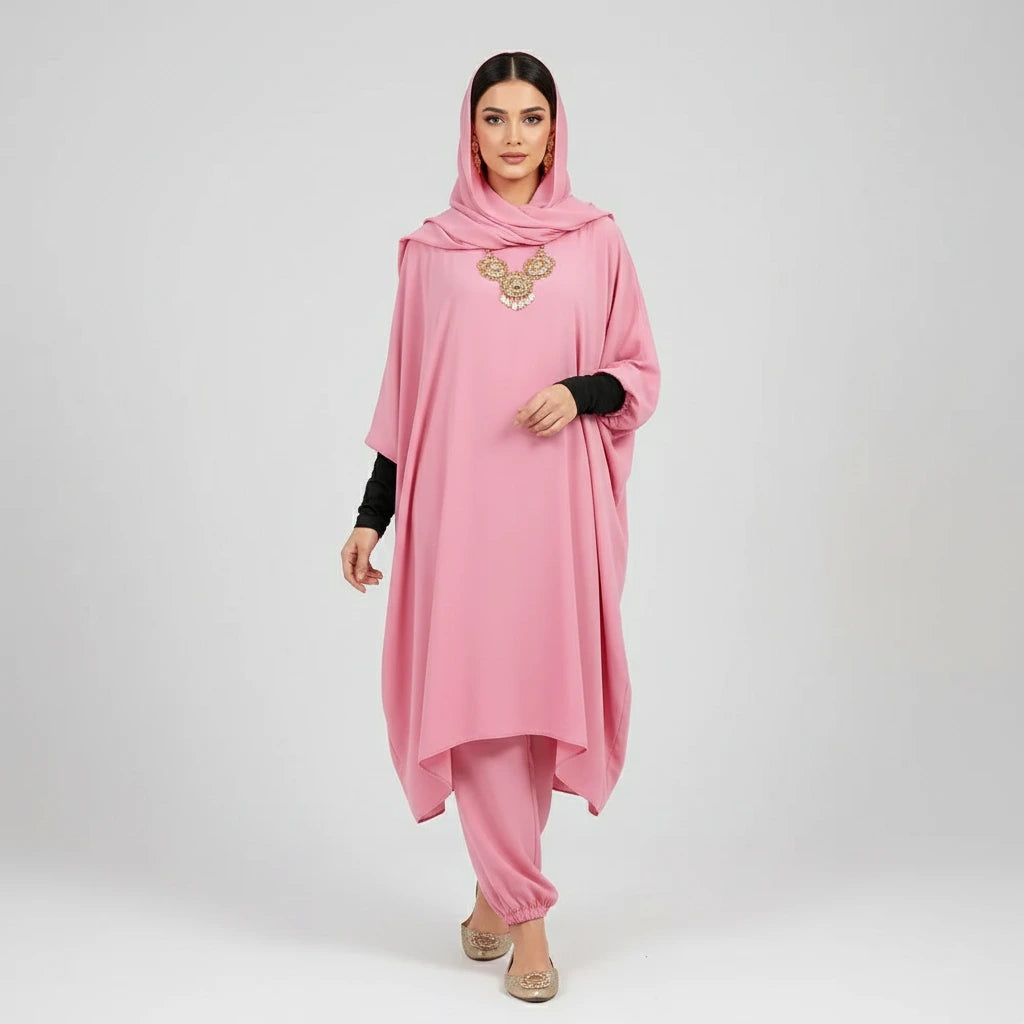 Woman wearing a pink traditional outfit with a hood on a white background