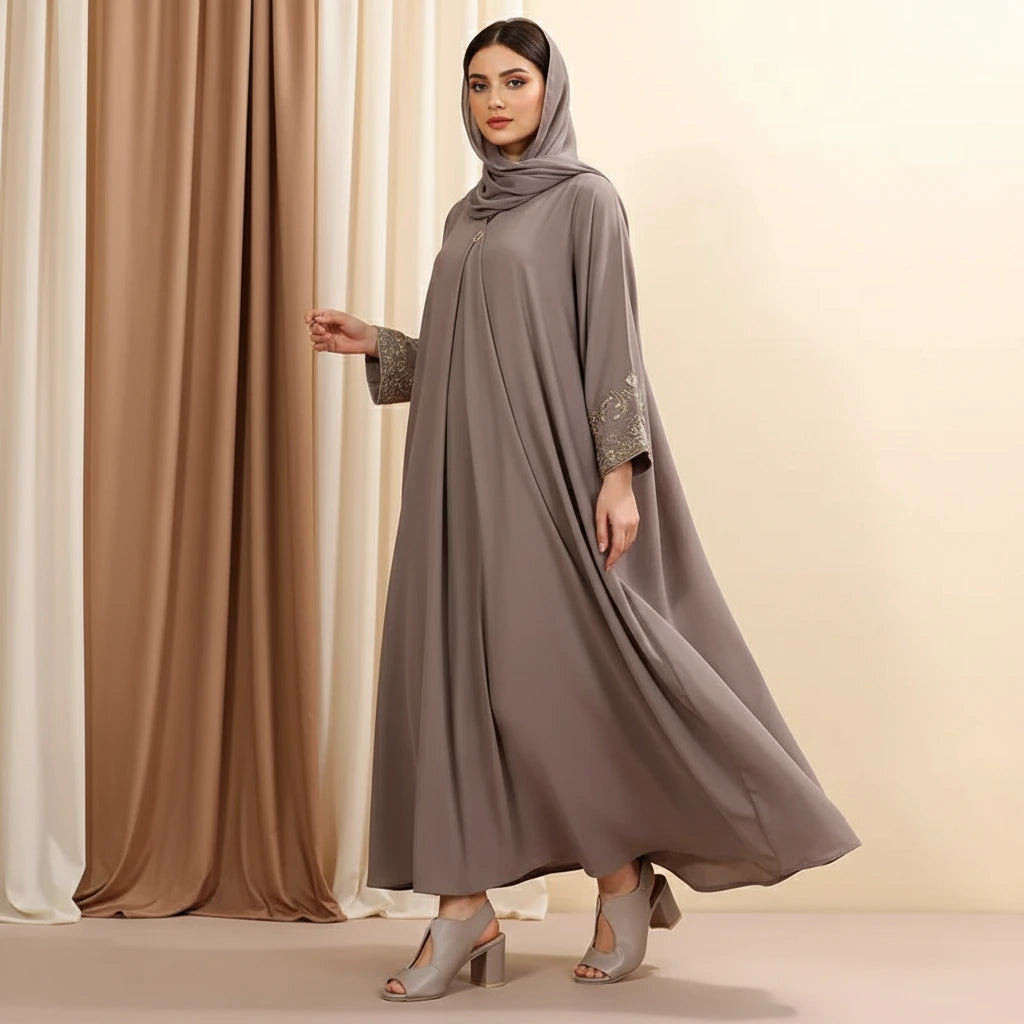 Pair of light gray open-toe high-heeled shoes on a beige background