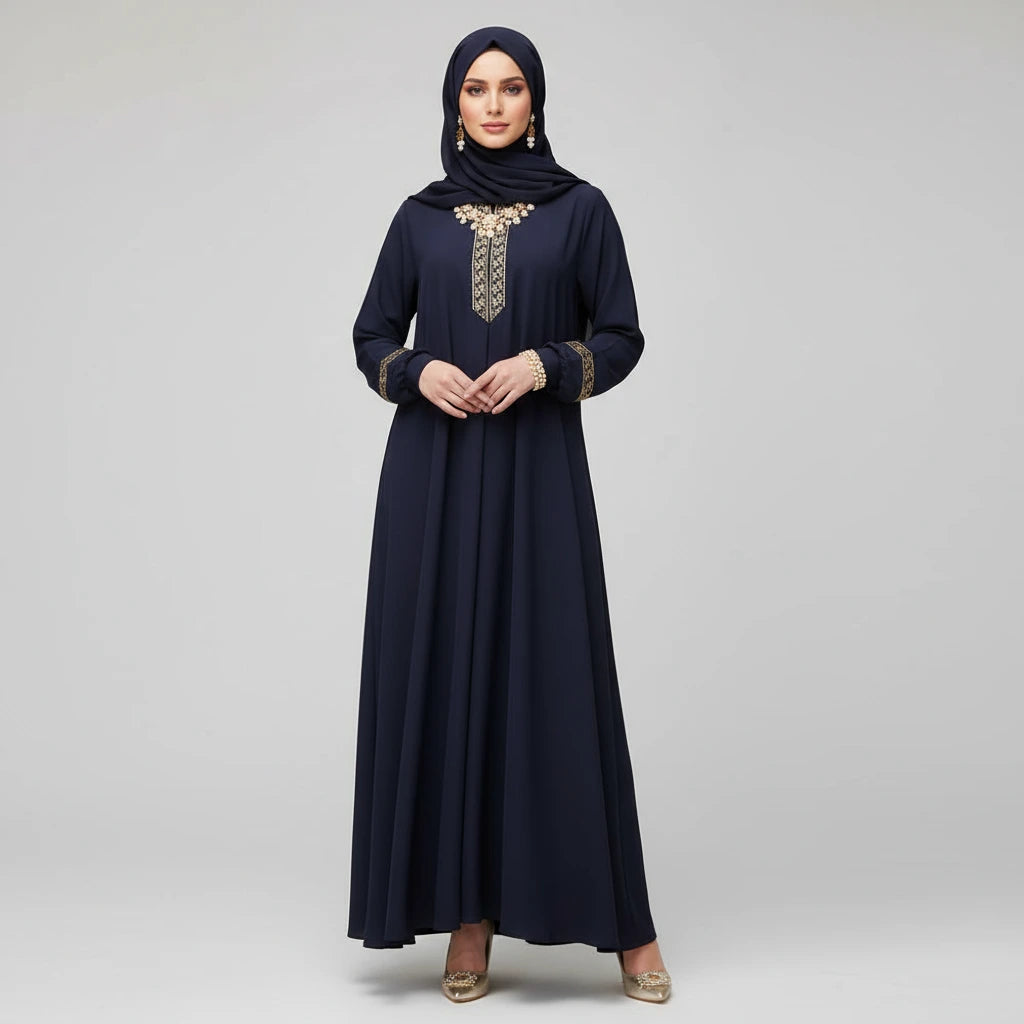 Navy blue dress with gold embroidery on a gray background