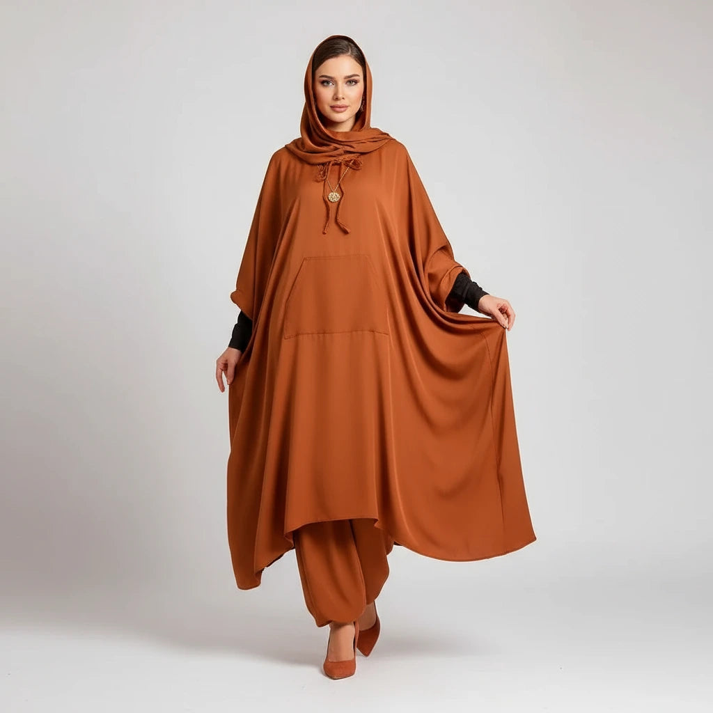 Woman wearing a brown outfit with a hood on a white background