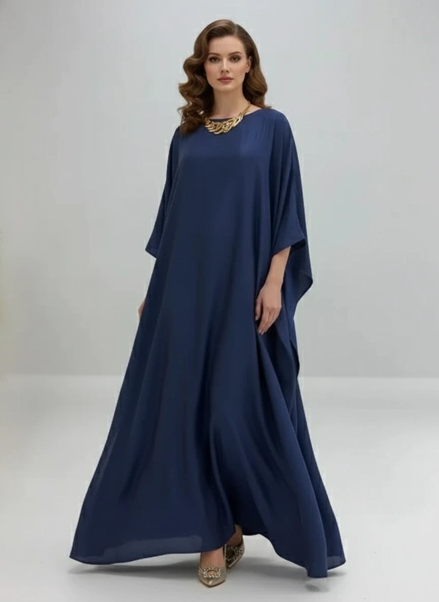 Navy blue dress on a mannequin against a white background