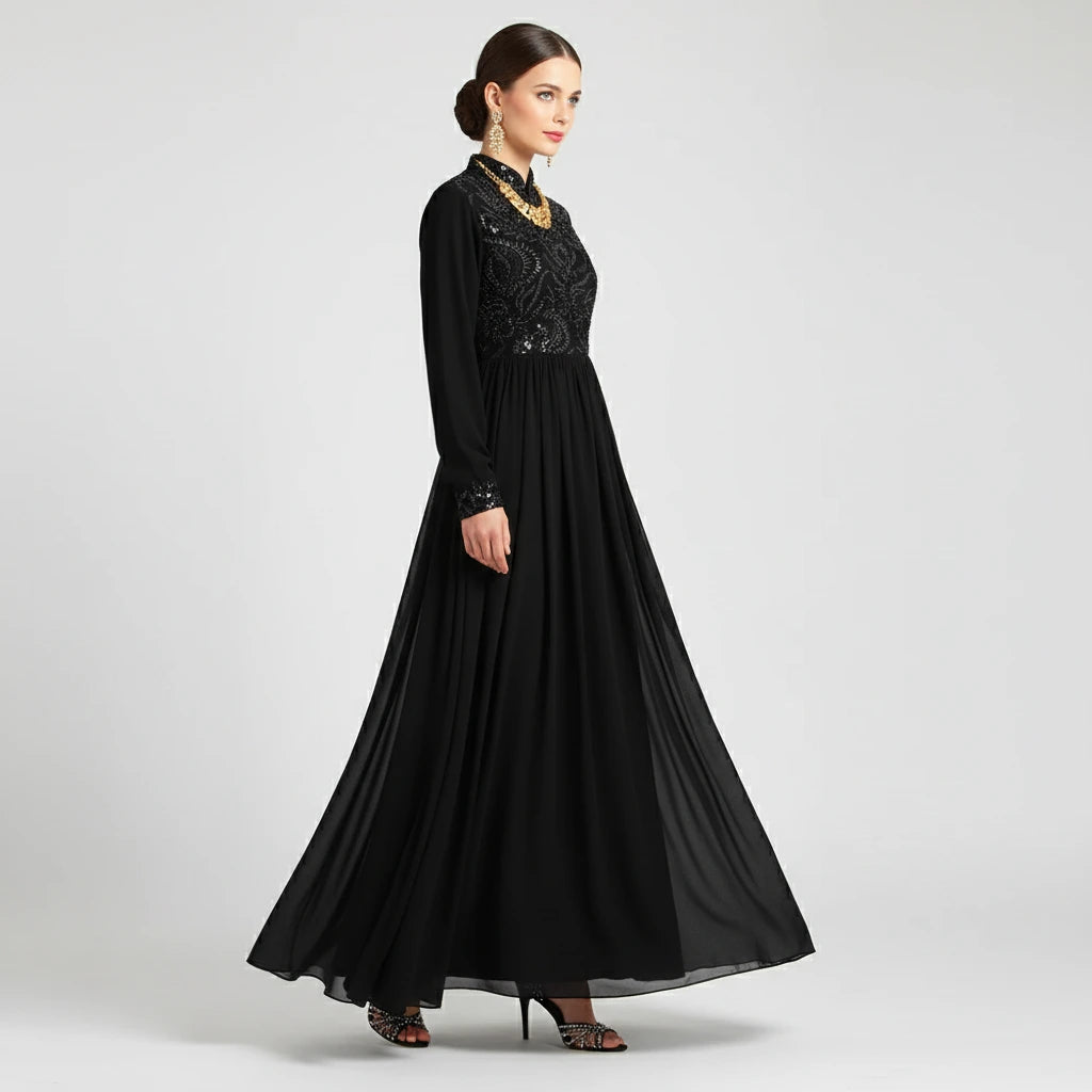 Black long dress with intricate design on a white background