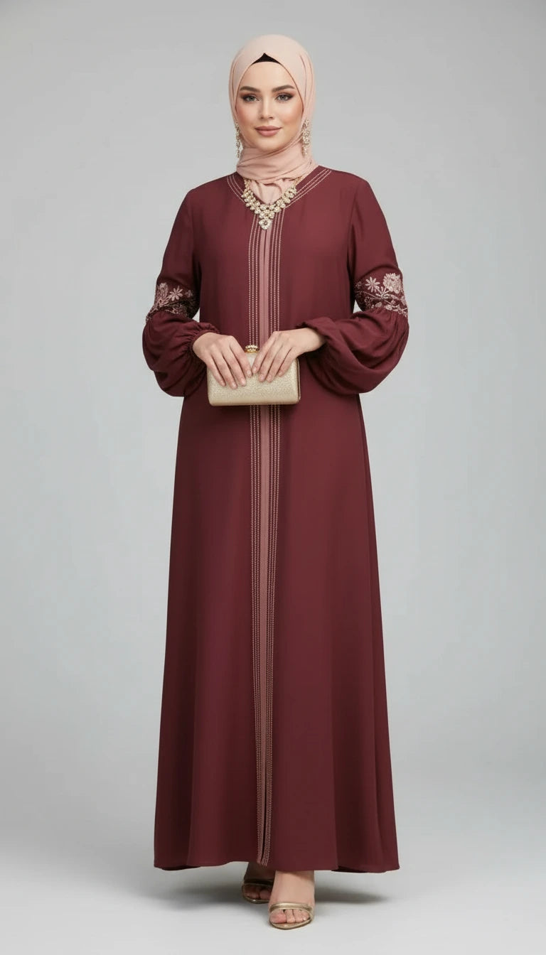 Maroon dress with floral embroidery worn by a person outdoors.