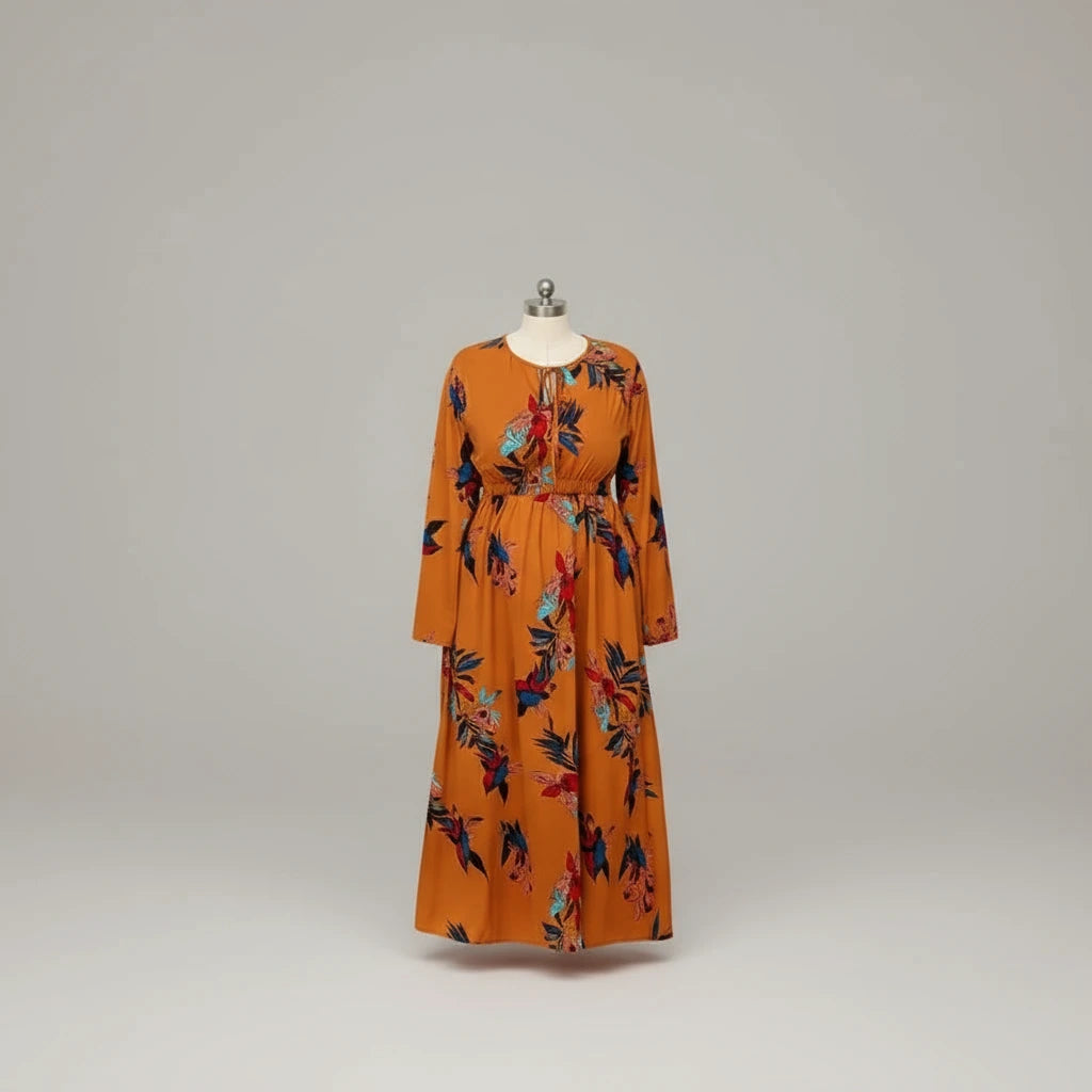 Orange dress with floral pattern on a mannequin against a gray background