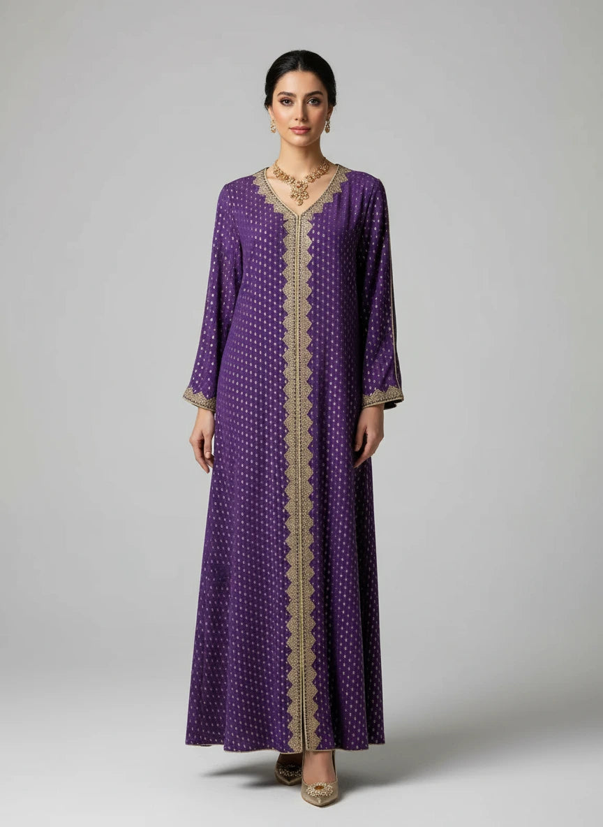 Purple dress with gold patterns on a mannequin against a white paneled wall.