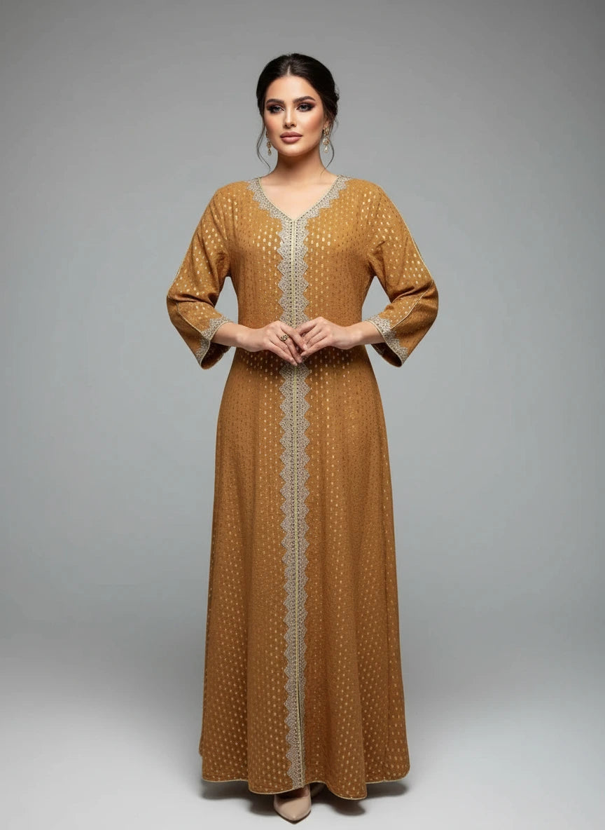 Mustard yellow dress with intricate detailing on a mannequin against a white paneled wall.